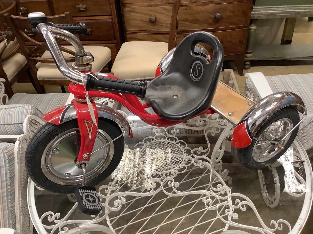 A Schwinn child's tricycle, length 84cm